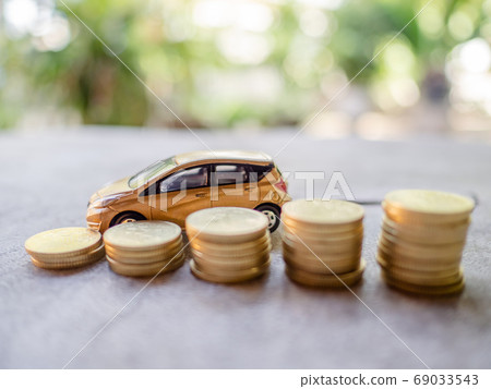 Golden cars with golden coins pile, business cars, Insurance, rent concept Golden cars with golden coins pile, business cars, Insurance, rent concept 69033543