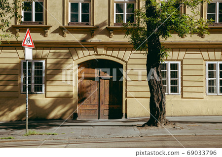 Old yellow building and morning street in Prague, Czech Republic 69033796