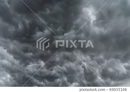 Dramatic dark grey clouds sky with thunder storm and rain. Abstr 69035106
