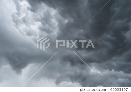 Dramatic dark grey clouds sky with thunder storm and rain. Abstr 69035107
