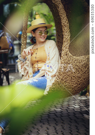 beautiful asian woman toothy smiling with relaxing lifestyle 69035380