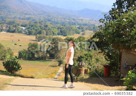 girl running and stand with the landscape view girl running and stand with the landscape view 69035382