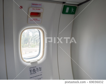 Emergency exit doors on the plane with the door opening method Emergency exit doors on the plane with the door opening method 69036832