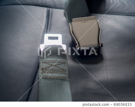 Safety seat belts on airplane chairs, Transportation and vehicle concept Safety seat belts on airplane chairs, Transportation and vehicle concept 69036833