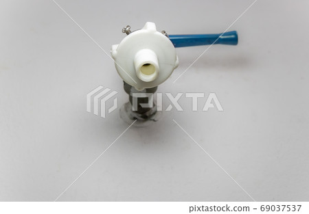The faucet in a wall, view from below. The tap 69037537