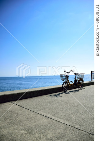 Bicycle parked on the coast 69038531