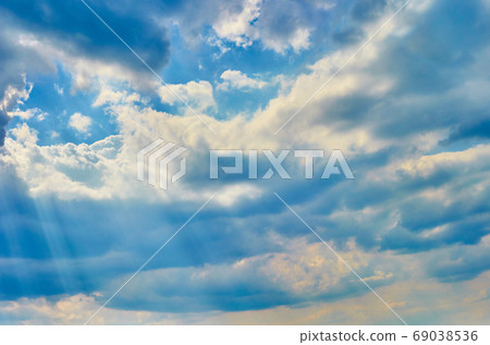 clouds on a textured vintage paper background, with retro stains clouds on a textured vintage paper background, with retro stains 69038536