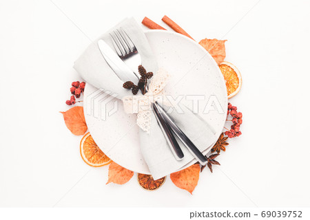 Thanksgiving autumn background decorated with autumn leaves, berries and spices. 69039752
