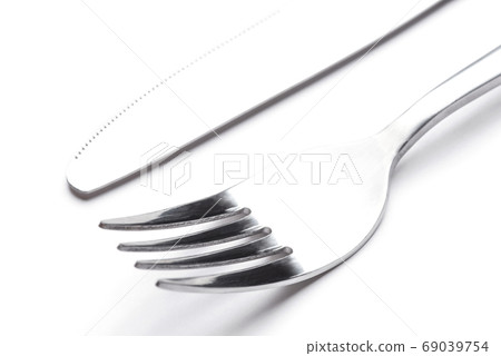 Steel fork and knife isolated on a white background. 69039754
