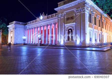night view of Primorsky boulevard in Odessa city, Ukraine. Beautiful city Park and illumination, walking people 69040307