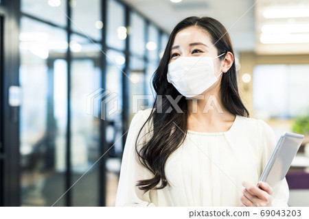 Business woman in mask form Business woman in mask form 69043203
