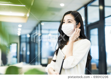 Business woman in mask form Business woman in mask form 69043206