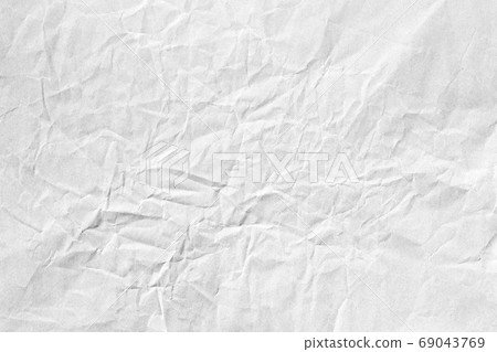 Crumpled white paper background texture Crumpled white paper background texture 69043769