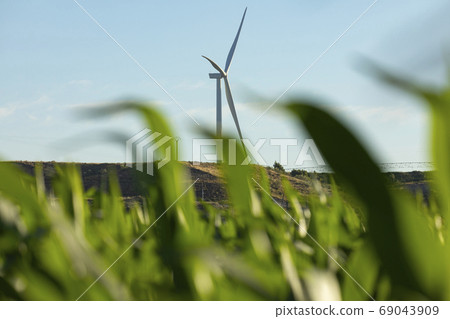 New wind turbines over the corn fields in Aragon, Spain New wind turbines over the corn fields in Aragon, Spain 69043909