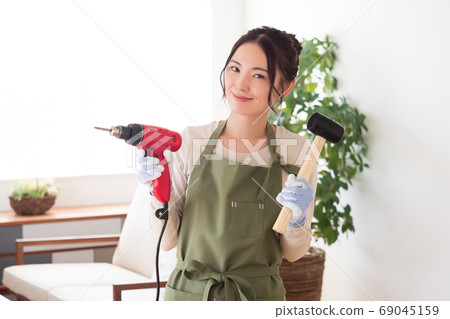 Woman enjoying DIY at home 69045159