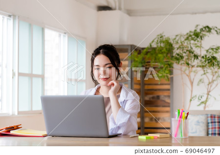 Young woman teleworking 69046497