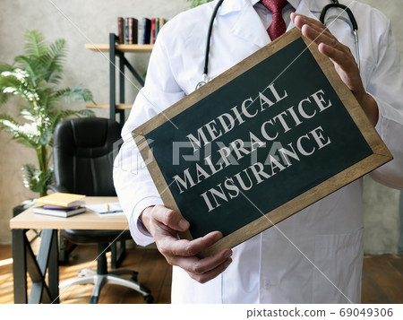 Medical malpractice insurance or professional liability concept. Doctor with blackboard. 69049306