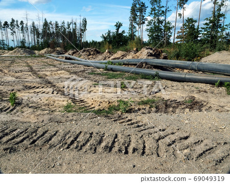 Deforestration, environmental destruction. The impact of industry on the environment, pipes laid in the forest. 69049319