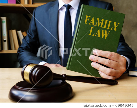 Attorney shows Family law book in the court about divorce. 69049345
