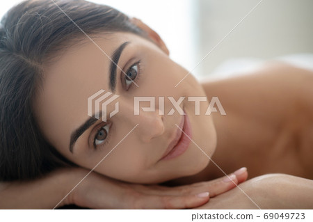 Close up picture of a smiling relaxed woman Close up picture of a smiling relaxed woman 69049723
