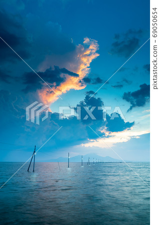 Sunset over the Ariake Sea Sunset over Nagata Sea Floor Road Sunset over the Ariake Sea Sunset over Nagata Sea Floor Road 69050654