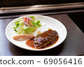 Lunch with hamburger, sausage and salad 69056416