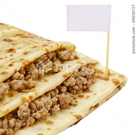 Pancake stuffed by meat white background view Pancake stuffed by meat white background view 69056727