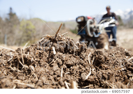 Plow the field with combine 69057597
