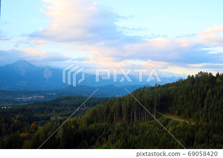 View of a beautiful bright sunset high in the mountains. selective focus. View of a beautiful bright sunset high in the mountains. selective focus. 69058420