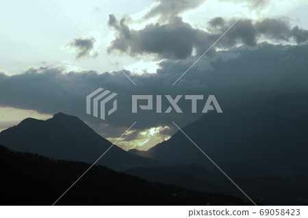 View of a beautiful bright sunset high in the mountains. selective focus. 69058423