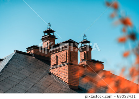 The house is of red brick with a copper roof 69058431