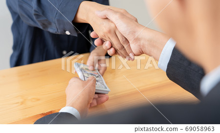 Businessman reciving money United States Dollars Businessman reciving money United States Dollars 69058963