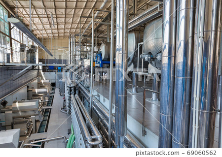 Stainless steel equipment for wine at modern winery. Stainless steel equipment for wine at modern winery. 69060562