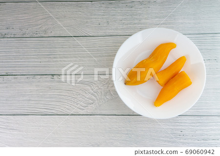 Ubi rebus or steam cassava is traditional malay dish on wooden background 69060942