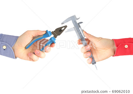 Hands with different working tools on white background. Industry Hands with different working tools on white background. Industry 69062010