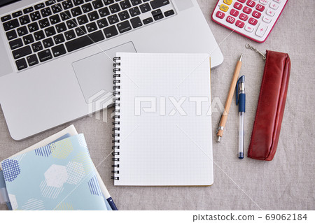 Notepad, writing instrument and laptop Notepad, writing instrument and laptop 69062184