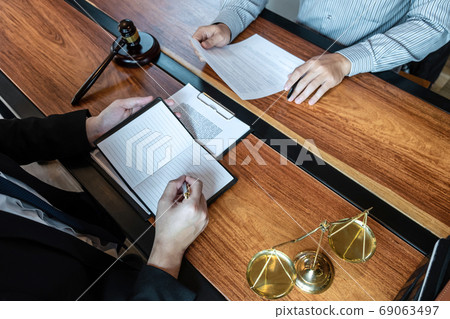 Male lawyer discussing negotiation legal case with 69063497