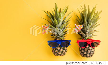 two pineapples in sunglasses two pineapples in sunglasses 69063530