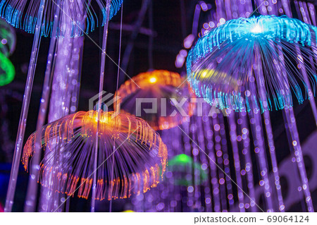Red blue neon garlands of bokeh lights and reflections. Red blue neon garlands of bokeh lights and reflections. 69064124