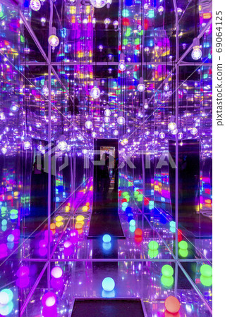 Red blue neon garlands of bokeh lights and reflections. 69064125