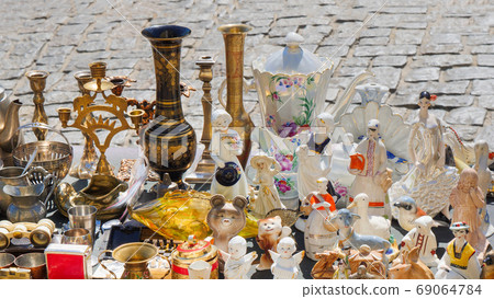 Spontaneous antiques market. Traditional small gifts, souvenirs from the Soviet Union. candlestick in a metal stand. Statuettes, candlesticks and other Russian, Soviet souvenirs. Antique service. Spontaneous antiques market. Traditional small gifts, souvenirs from the Soviet Union. candlestick in a metal stand. Statuettes, candlesticks and other Russian, Soviet souvenirs. Antique service. 69064784