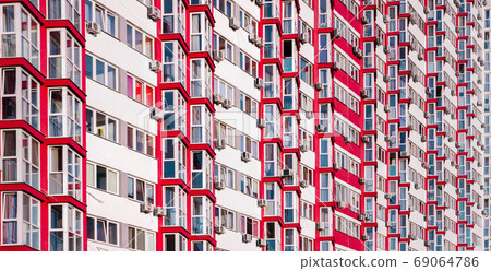 Detail in Modern residential flat apartment building exterior. Fragment of New luxury house and home complex. Part of City Real estate property and condo architecture. Background of real estate market Detail in Modern residential flat apartment building exterior. Fragment of New luxury house and home complex. Part of City Real estate property and condo architecture. Background of real estate market 69064786