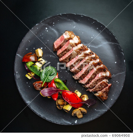 Beef tagliata meat with grilled vegetables 69064908