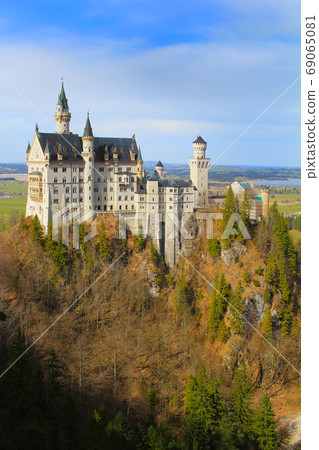 A girl looking at castle Neuschwanstein A girl looking at castle Neuschwanstein 69065081