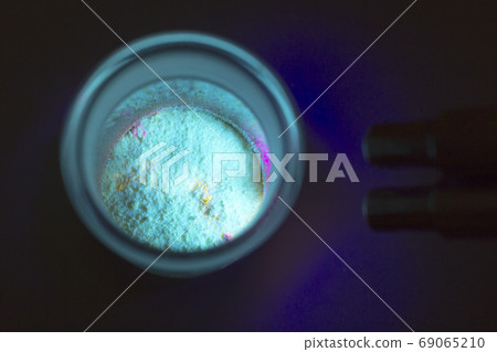 Fluorescent organic materials of  green color for production OLED inside glass bottle in UV light. 69065210