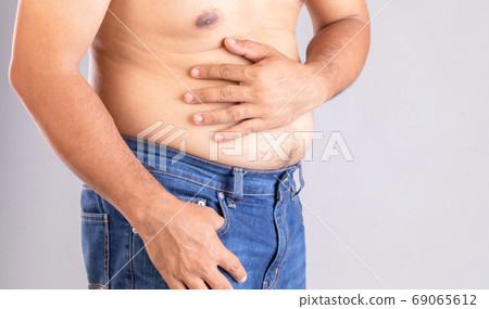 Stomach ache or pain on belly concept Stomach ache or pain on belly concept 69065612