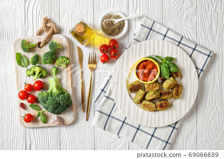 baked broccoli totsbaked broccoli tots on a plate, top view baked broccoli totsbaked broccoli tots on a plate, top view 69066689