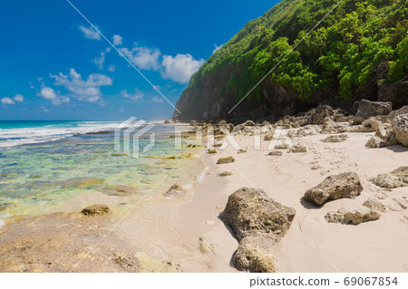 Tropical beach in Bali. Paradise beach and blue ocean, no people Tropical beach in Bali. Paradise beach and blue ocean, no people 69067854