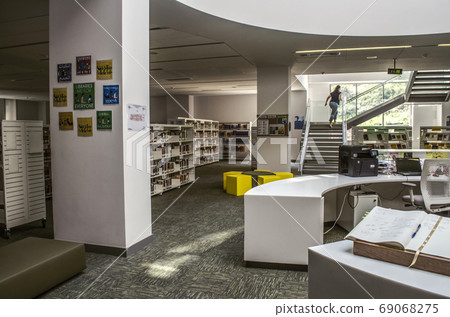Staircase, as part of the interior,about large window between the columns in the library leading to the upper floor at the International College in Dilijan Staircase, as part of the interior,about large window between the columns in the library leading to the upper floor at the International College in Dilijan 69068275