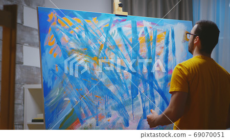 Hand painting in art studio 69070051